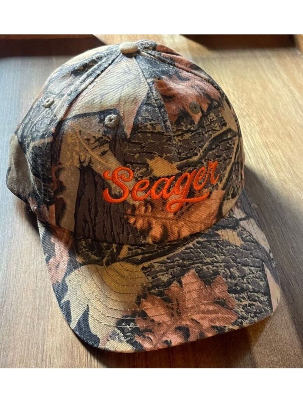 Seager Grit Company Camouflage Snapback Cap with Orange Embroidered Logo